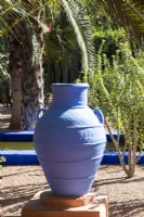 A blue painted amphora, terracotta container in Jardin Majorelle, Yves Saint Laurent garden
