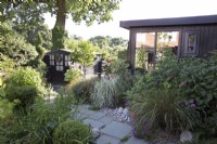 Contemporary garden with garden office