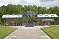 Glasshouse with display of potted plants at Yeo Valley Organic Garden, May