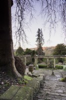 View down steps and across the Great Terrace at Iford Manor in January