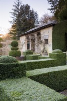 Box parterre with the Casita behind at Iford Manor in January