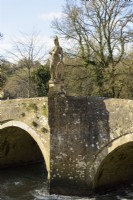 Statue of Britannia on a bridge over the River Frome beside Iford Manor