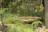 RHS Chelsea Flower Show 2023 - Water feature in The Nurture Landscapes Garden designed by Sarah Price