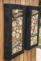 Decorative insect habitat panels - designer Tom Massey - RHS Resilient Garden, RHS Hampton Court Palace Garden Festival.