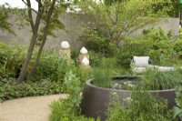 RHS Chelsea Flower Show 2023 - Water feature amongst mixed planting - The RBC Brewin Dolphin Garden designed by Paul Hervey-Brookes Silver-Gilt