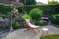 Deck chair in small garden 