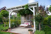 Arbor with swing lounger 