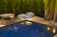 Lighting in evening by the pool. Water bowl feature, brass floor lamps inspired by nature and floating candles.
Designer: Vetschpartner, Berger Gartenbau and Livingdreams. Giardina-Zurich, Swiss. 


 
