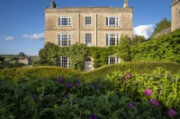 Daglingworth House, Gloucestershire with Rosa rugosa 'Roseraie de l'Hay'