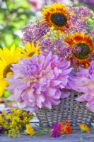 Summer flower arrangement with dahlias, eupatorium and sunflowers.