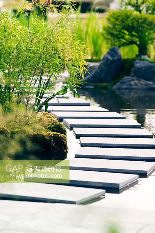 Stepping stones in curved path surrounded by water - 'Walk on Water' 