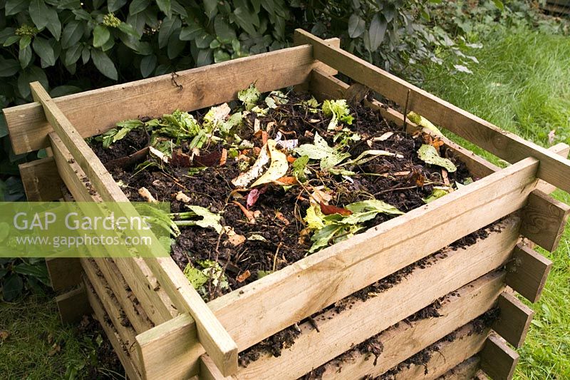 Compost heap in slatted wooden box