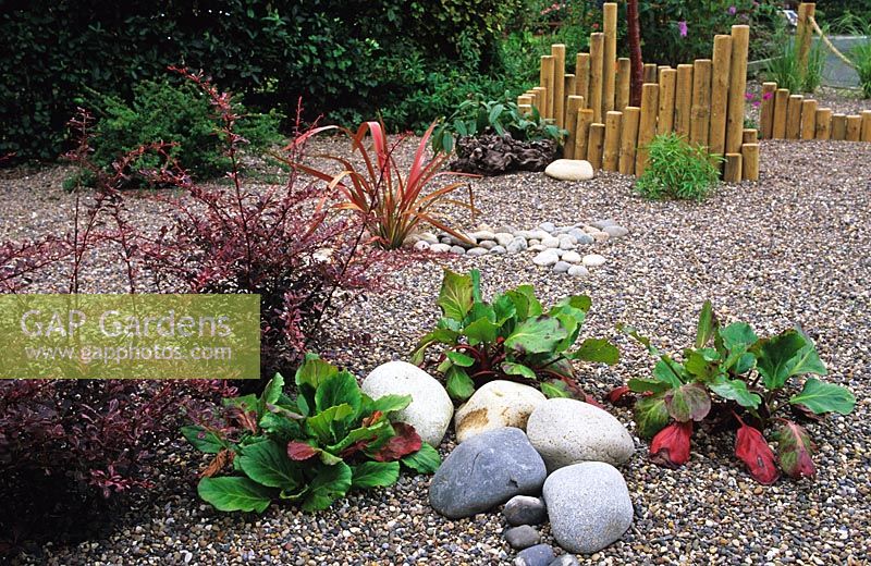 Dry gravel garden beach stones and bamboo sculpture in Whitley Bay, Tyne and Wear