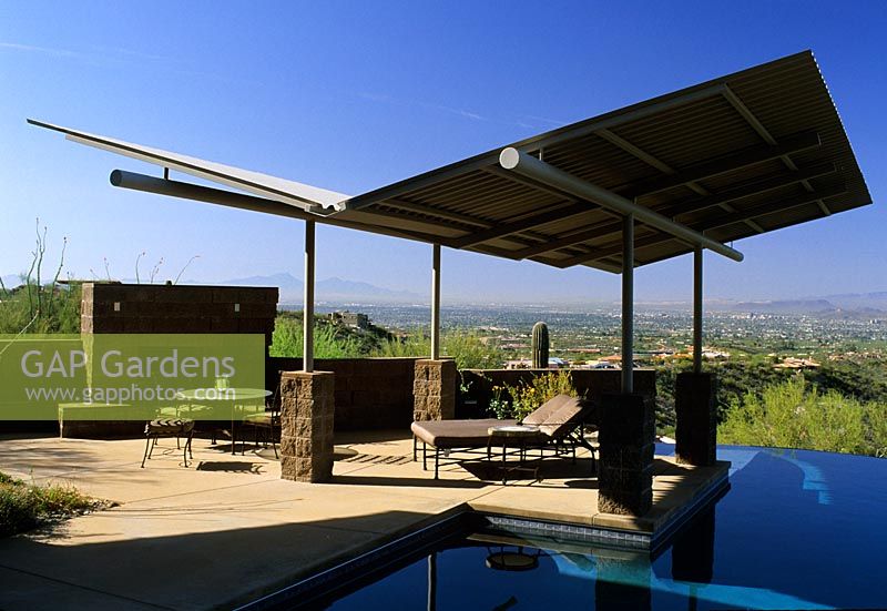 Patio with furniture and sun screens in The Stiteler Garden in Tucson, Arizona USA