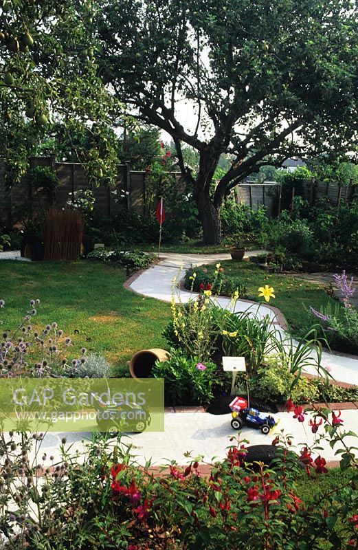 Childs racing track - path providing surface for all year access to entire garden. Wood St, Ryde on The Isle of Wight