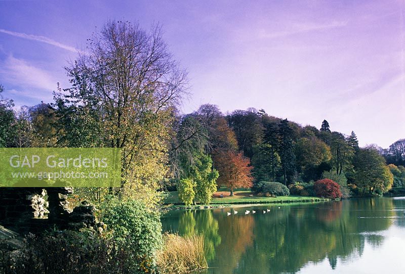 The Lake and ruins in autumn at Stourhead in Wiltshire. 