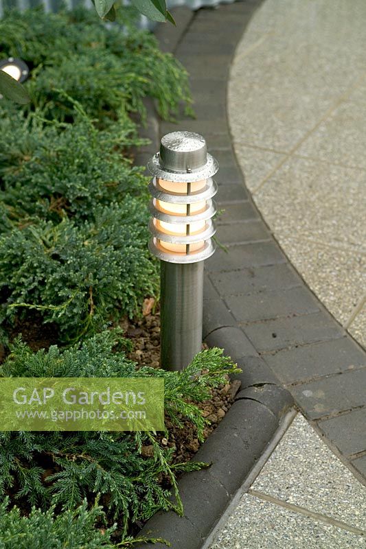 Garden lighting - steel pillar light on edge of path, Capel Manor Show Gardens