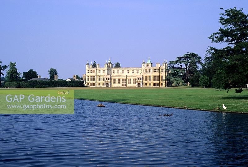 Lake and lawn with view to house at Audley End in Essex