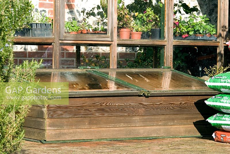 Lean to cedar greenhouse and matching coldframe by Gabriel Ash in Newmarket