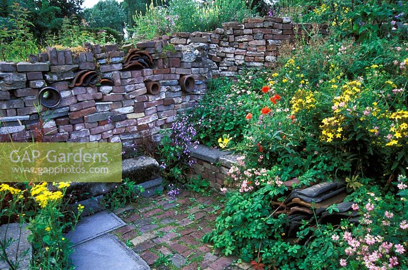 Drystone wall and colourful planting at Wildlife garden, 'Oase' in  Netherlands  