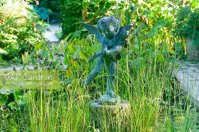 Statue in pond area at Heligan Garden, Cornwall