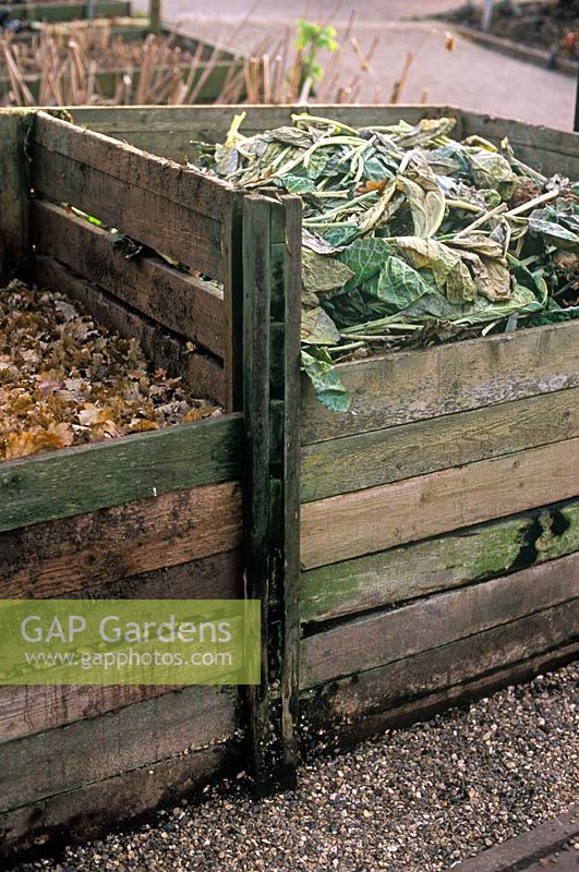 Wooden compost bins, one for general compost and one for leaf mould 