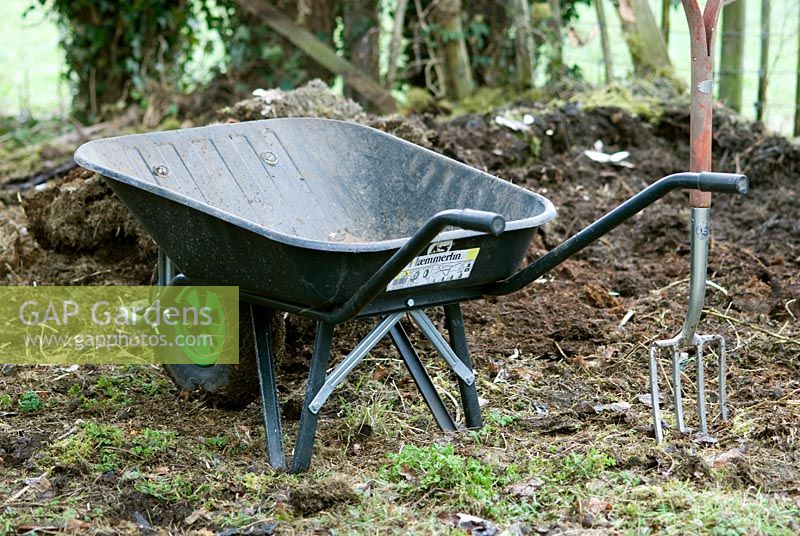 Wheelbarrow and well rotted compost