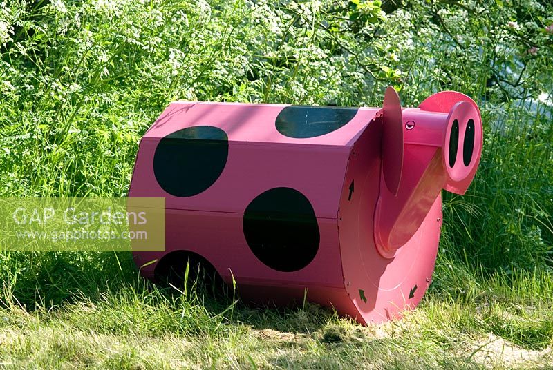 Rolypig - a composter for children to use.  Can be used for composting kitchen and garden waste. The waste is put in to the pig  by lifting his snout and it comes out as compost at the rear end after 12 weeks. The Pig is rolled to introduce air into the composting process which speeds it up.