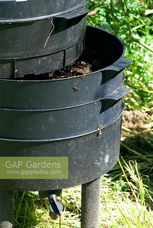 Wormery (Worm Tower or Can-o-worms) used to turn garden and kitchen waste into garden compost by the action of worms. Middle level tray with part worked waste - the majority of the worms are here
