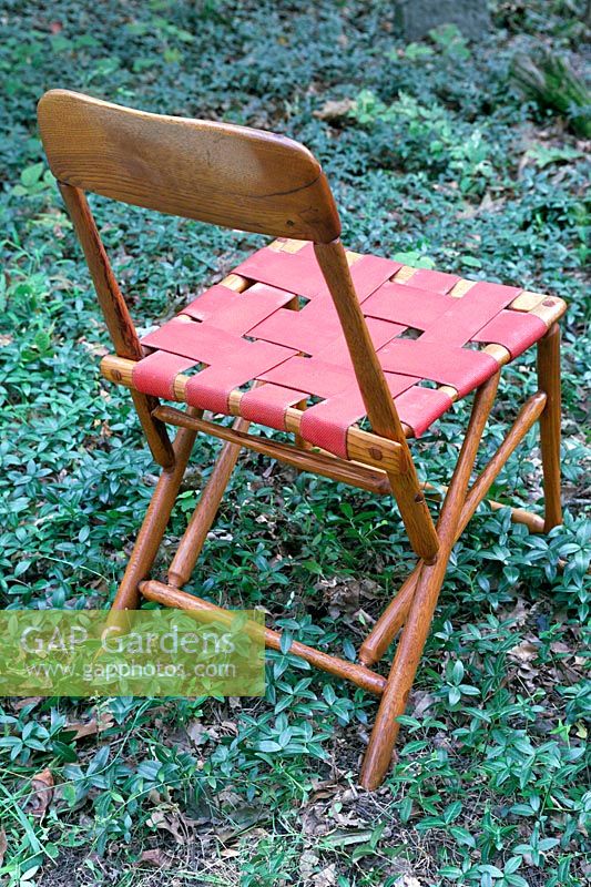Chair with red webbing seat 