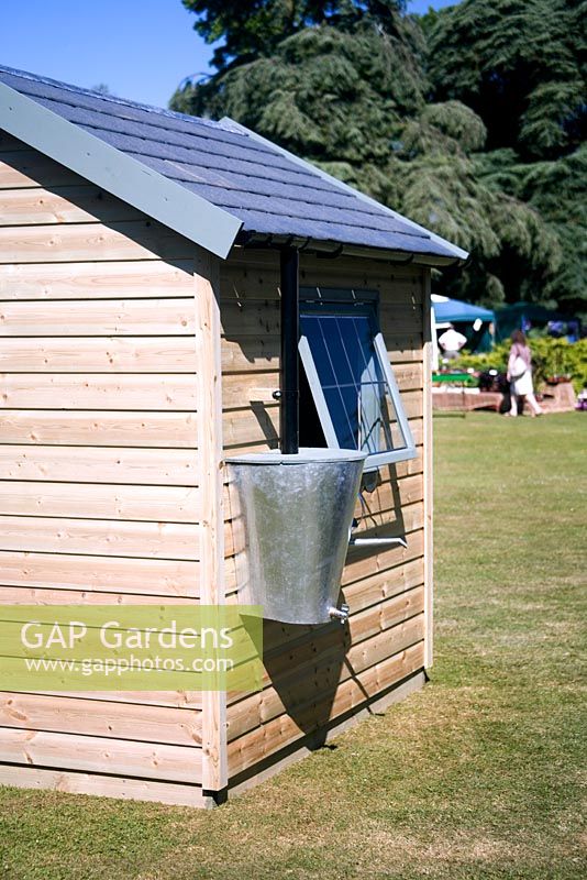 Garden shed and galvanised rainbut on display at West Dean mid-summer garden festival held each June