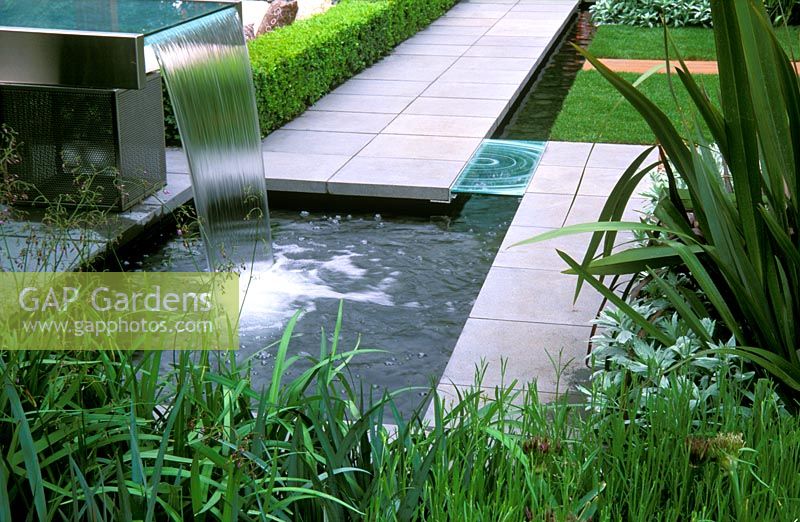 Contemporary glass and steel water feature with pond.  Fleming's Nurseries Australian Garden, Chelsea Flower Show 2006.