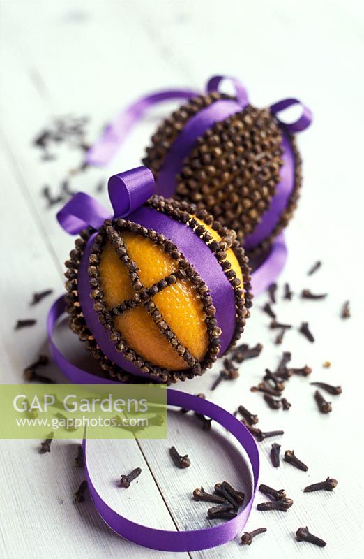 Orange pomander with Cloves and ribbons