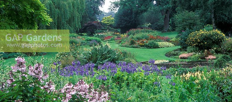 The Dell Garden, Bressingham - View of the garden with island beds and borders of mixed herbaceous perennials