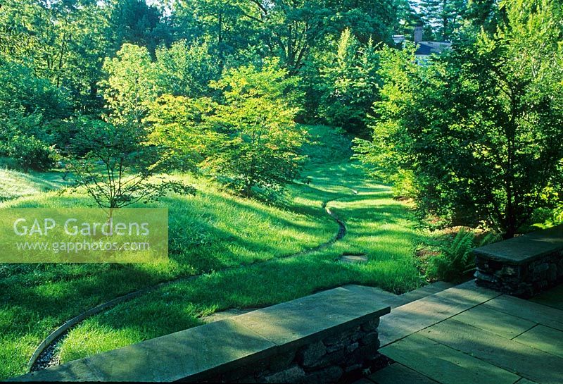 Land sculpting - Rill winding through undulating garden with dips and mounds covered with grass - The Healing Garden, Boston