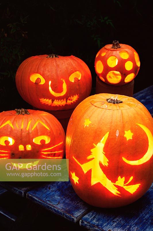 Halloween carved pumpkins lit with candles - October, Autumn