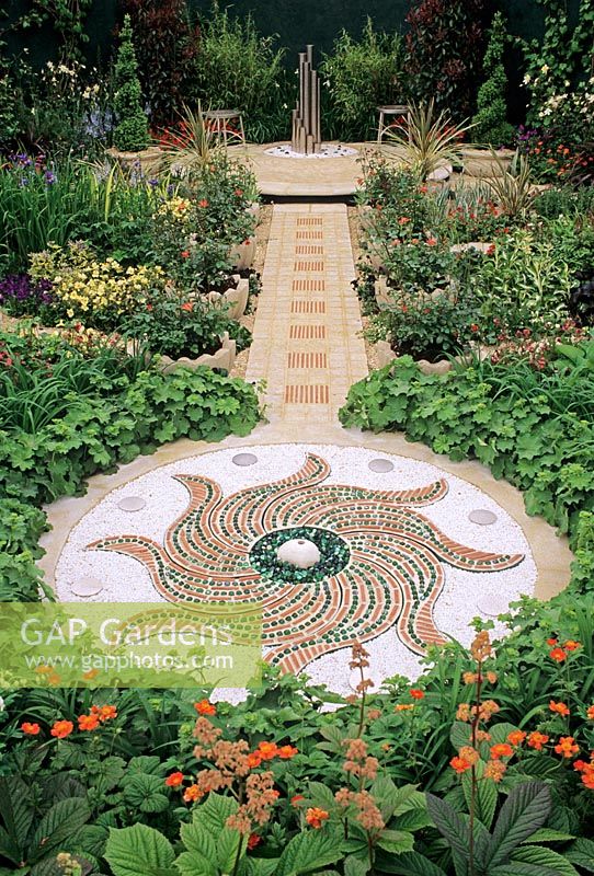 Water feature in circular Mosaic with path leading to patio - The National Asthma Campaign Chelsea 1996 