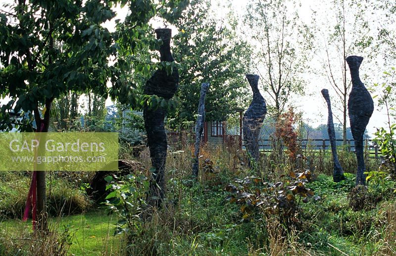 'Casting Shadows' sculptures by Maryanne Nicholls and Prunus tree - The Lucy Redman School of Garden Design, Suffolk