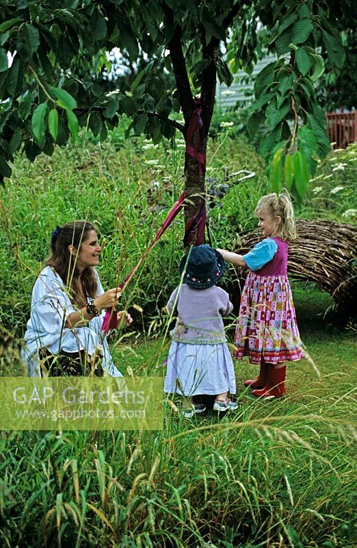 Lucy Redman and her daughters around the maypole - The Lucy Redman School of Garden Design, Suffolk