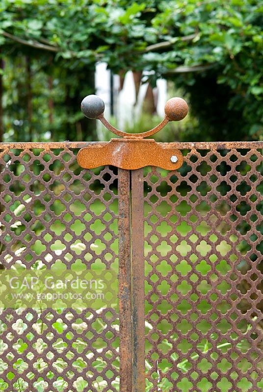 Iron gate made from old Greenhouse grills