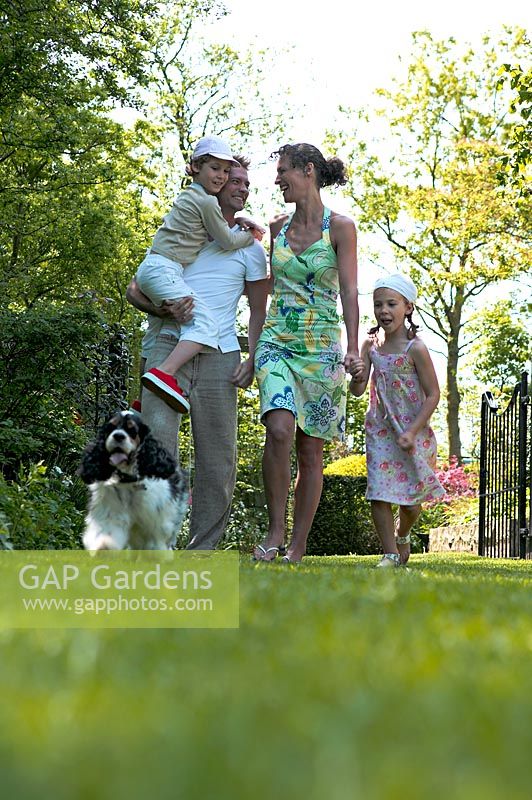 Family walking through garden
