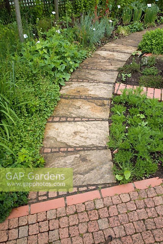 A curved path made from square paving stones, Garden Organic at Ryton
