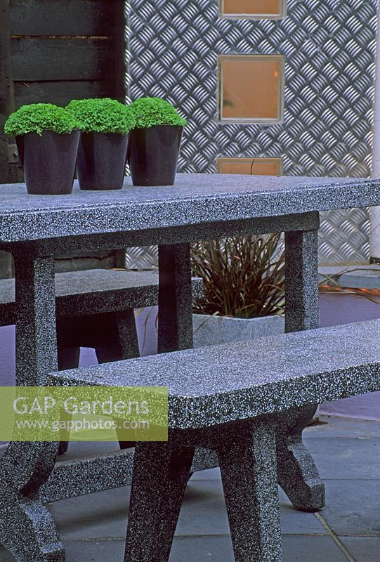 Granite table and chairs with Soleirolia in pots - Battersea, London

 