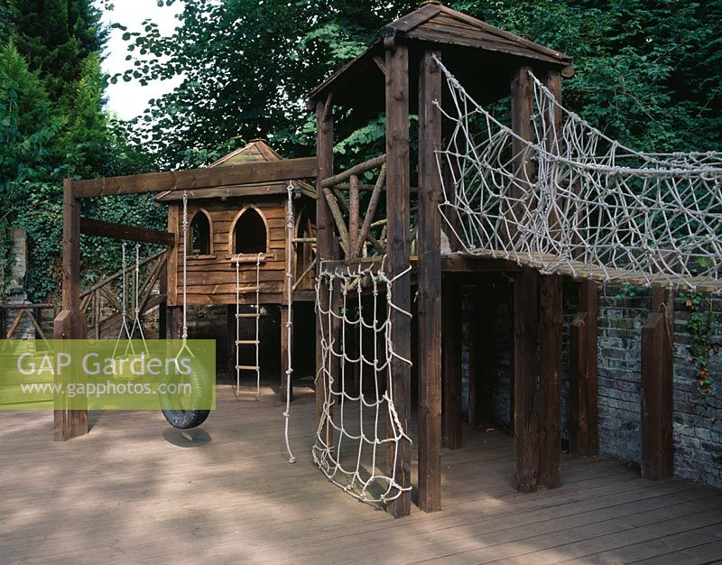 Childrens wooden play equipment on decking
