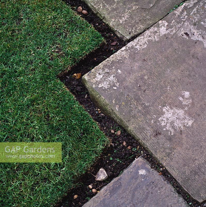 Decorative turf edging and old york stone paving