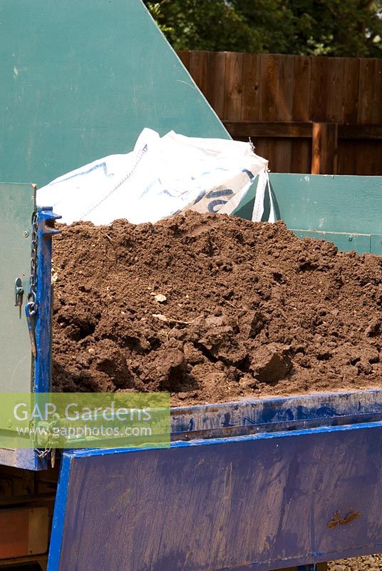 Top soil in the back of a trailer
