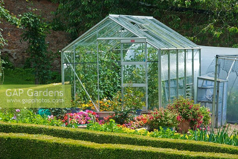 Greenhouse in formal vegetable garden - Bickham Park, Devon