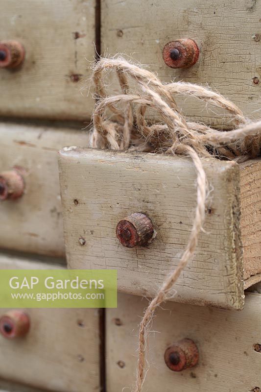 Natural jute garden twine in small rustic set of drawers