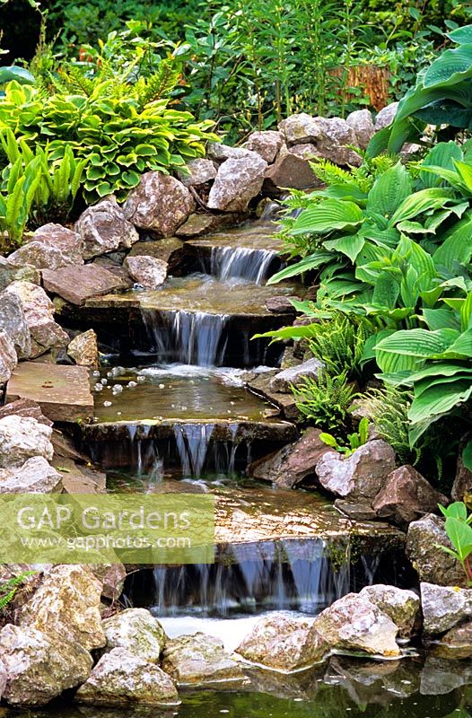 A small garden water feature - water cascading down stone steps