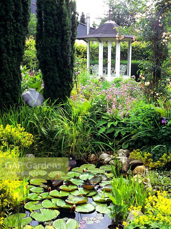 Pond in country garden with pavillon